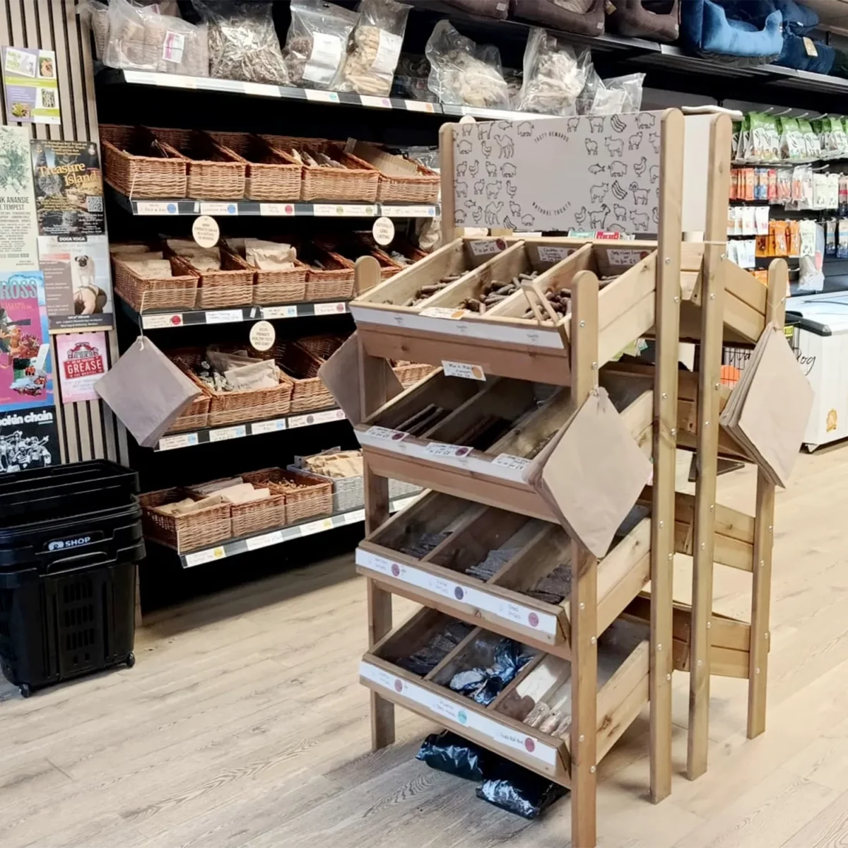Natural dog treats displayed on shelves inside an independent pet shop